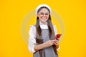 Happy face, positive and smiling child girl 12, 13, 14 years old with smart phone. Hipster teen girl types text message