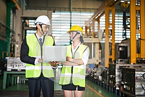 Happy factory workers in warehouse. teamwork