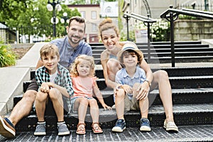 Happy familly of five in the park