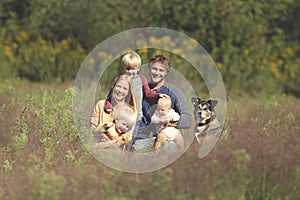 Happy Family of 5 People and Dog in Sunny Garden