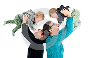 Happy family with adopted twins is laughing. Isolated on white. photo