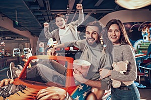 Happy family in amusement center