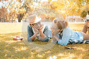 Happy family asian senior couple retirement smile in nature park relax vacation time