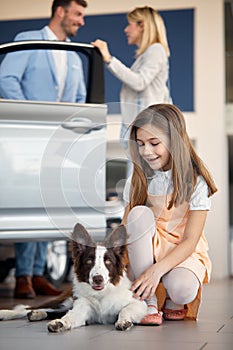 Happy family at auto shop wants to buy a new car. Car, shop, buying