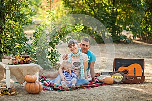 Happy family at autumn picnic