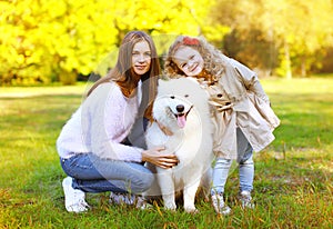 Happy family autumn, portrait pretty young mother and child walk