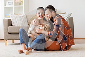 Happy family with baby at home