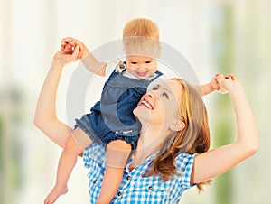 Happy family. baby sits astride the shoulders of the mother