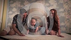 A happy family, Baby smiling with parents