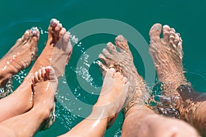 Happy family. Bare feets in the water of the sea boy, mother, father. Positive human emotions, feelings, joy. Funny cute child