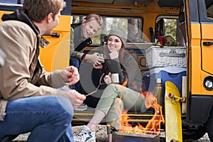 Happy family basking near the fire