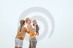 Happy family on the beach.  Father, mother and baby having fun on summer vacation. Holiday travel concept