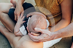 Happy family on the beach.  Father, mother and baby having fun on summer vacation. Holiday travel concept