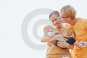 Happy family on the beach.  Father, mother and baby having fun on summer vacation. Holiday travel concept