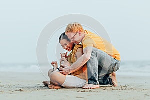 Happy family on the beach.  Father, mother and baby having fun on summer vacation. Holiday travel concept