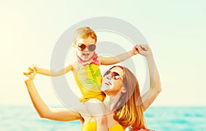 Happy family on the beach. mother and child daughter