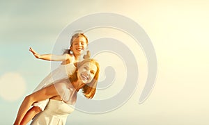 Happy family at beach. mother hugging child daughter