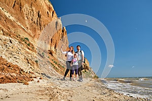 Happy family on the beach. People having fun on vacation