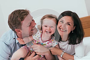 Happy family in bed