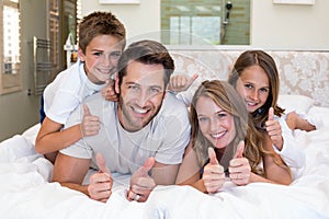 Happy family on the bed