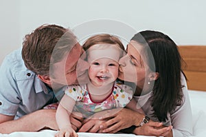 Happy family in bed