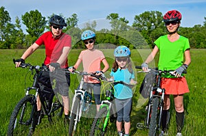 Happy family on bikes