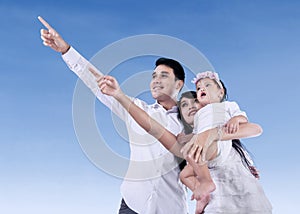 Happy family with blue sky