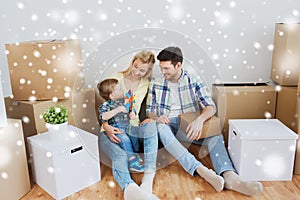 Happy family with boxes moving to new home