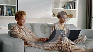 Happy family browsing web together closeup. Freelancers couple working home