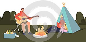 Happy family camping together: parents and kid sitting around camp fire and tent