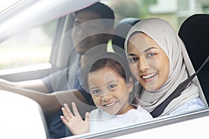 Happy family in a car