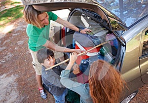 Happy family, car and packing for camping road trip, holiday or vacation above in nature outdoors. Top view of dad and