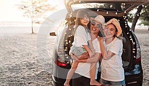 Happy Family with car travel and camping road trip. summer vacation in car in the sunset, Dad, mom and daughter happy traveling