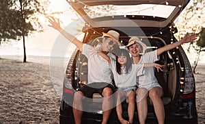 Happy Family with car travel and camping road trip. summer vacation in car in the sunset, Dad, mom and daughter happy traveling