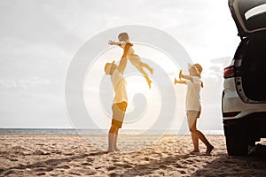 Happy Family with car travel road trip. summer vacation in car in the sunset, Dad, mom and daughter happy traveling enjoy together