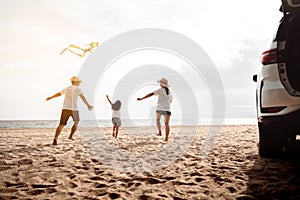 Happy Family with car travel road trip. summer vacation in car in the sunset, Dad, mom and daughter happy traveling enjoy together