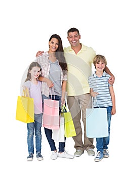 Happy family carrying shopping bags
