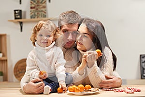 Happy family celebrates Christmas in the kitchen, love, sincerity and warmth