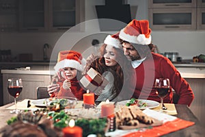 Happy family celebrating Christmas together at home
