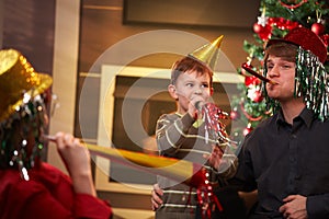 Happy family celebrating new year's eve together