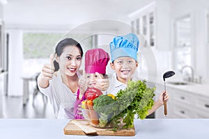 Happy family chef and vegetable at home