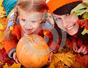 Happy family child autumn orange leaf, pumpkin