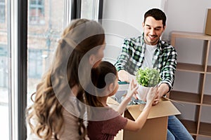 Happy family with child moving to new home