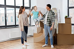 Happy family with child moving to new home