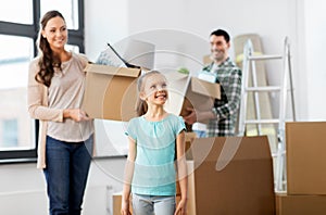 Happy family with child moving to new home