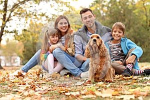 Happy family with children and dog in park