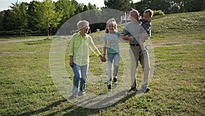 Happy family with children having fun in park