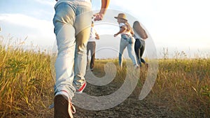 happy family children kid together run in the park silhouette. people in the park concept mom dad daughter and son