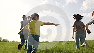 happy family. children kid together run in the park at sunset. people in the park concept. mom dad daughter and son