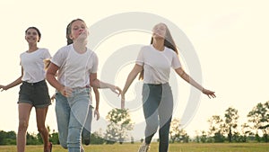 Happy family children lifestyle kids together run in park at sunset silhouette. people in park concept mom a dad